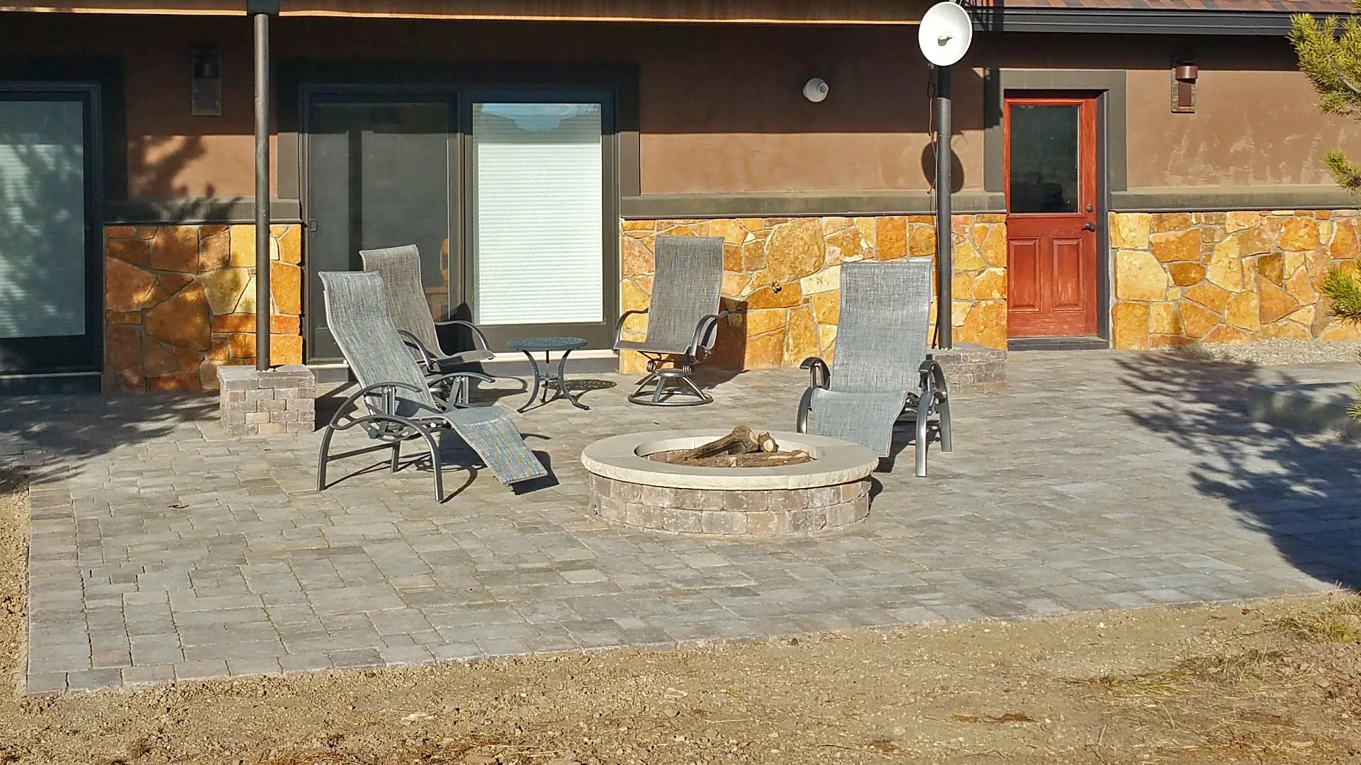  A new paver patio that was installed by our team of professionals in the back yard of a home in Fraser, CO.