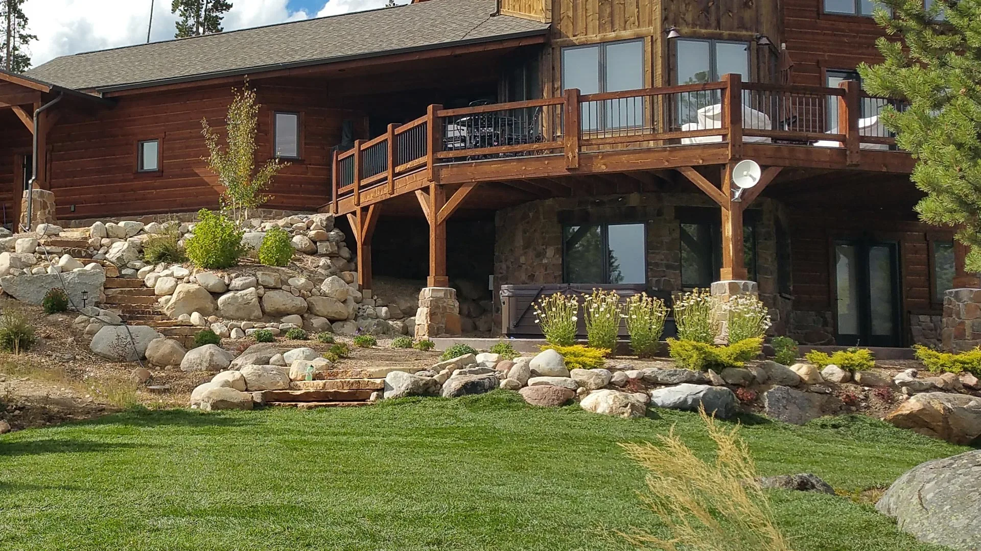 A completed project at a home in Winter Park, CO that includes hardscaping and landscaping.